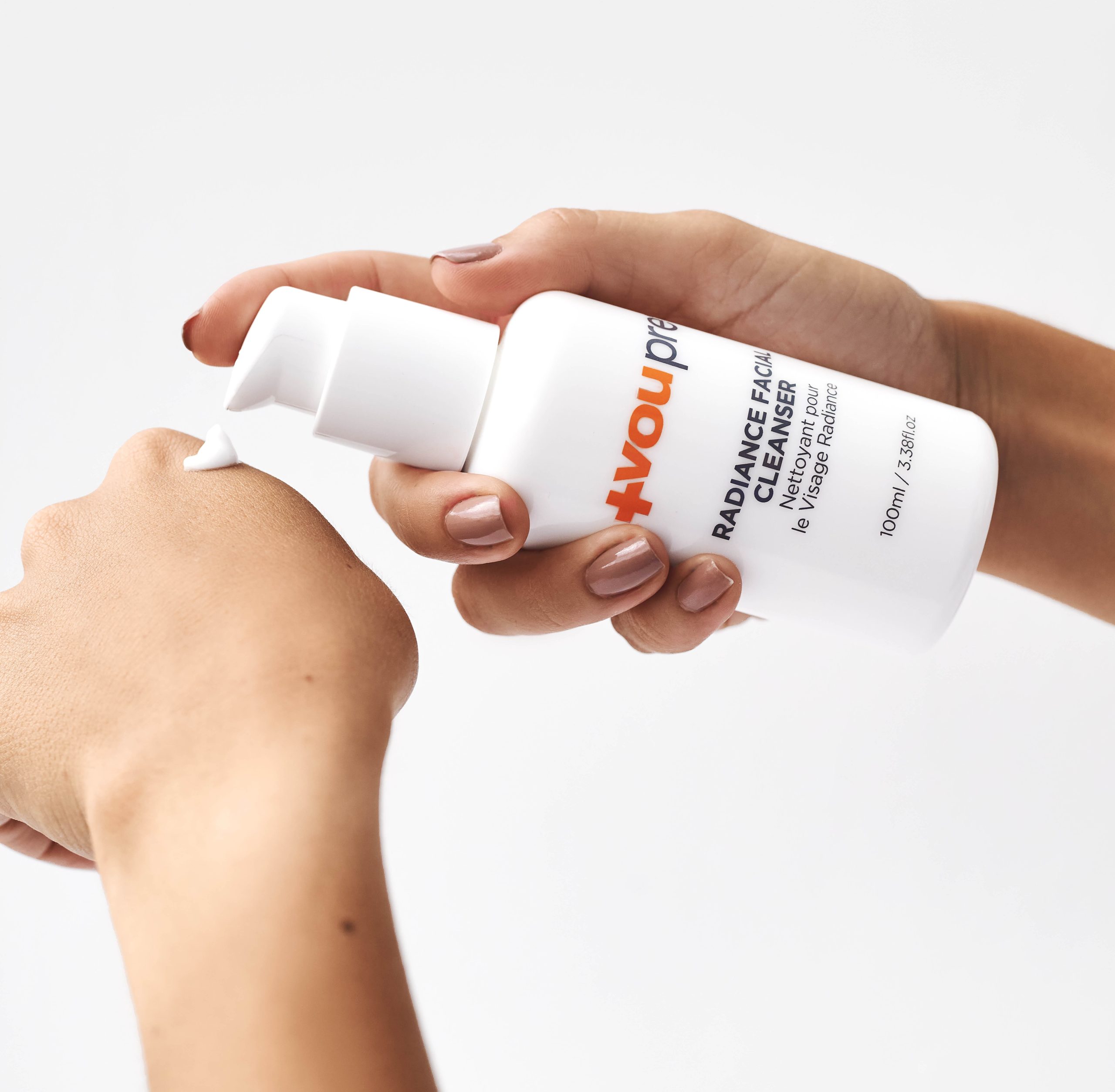 Woman using the VouPre Radiance Facial Cleanser