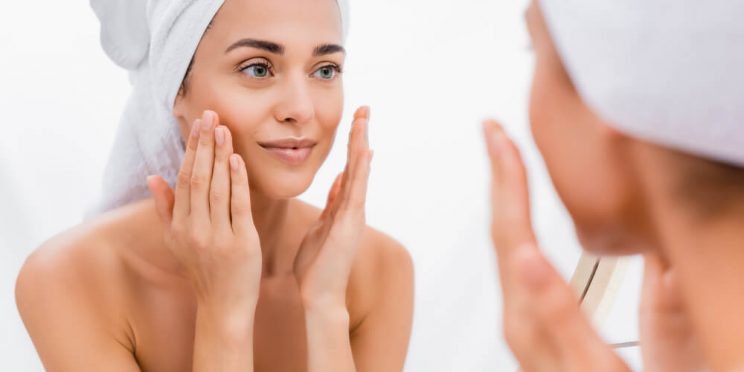 Woman following daily skincare routines