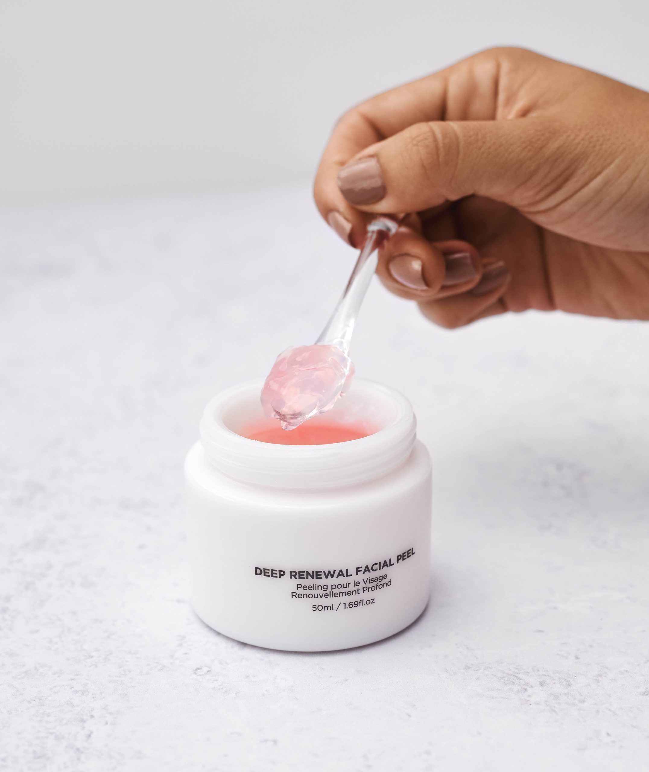 Hand scooping out some of the VouPre Deep Renewal Facial Peel