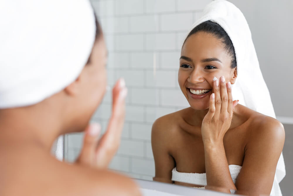 Woman applying face cream