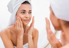 Woman following daily skincare routines