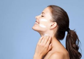 woman applying facial cream