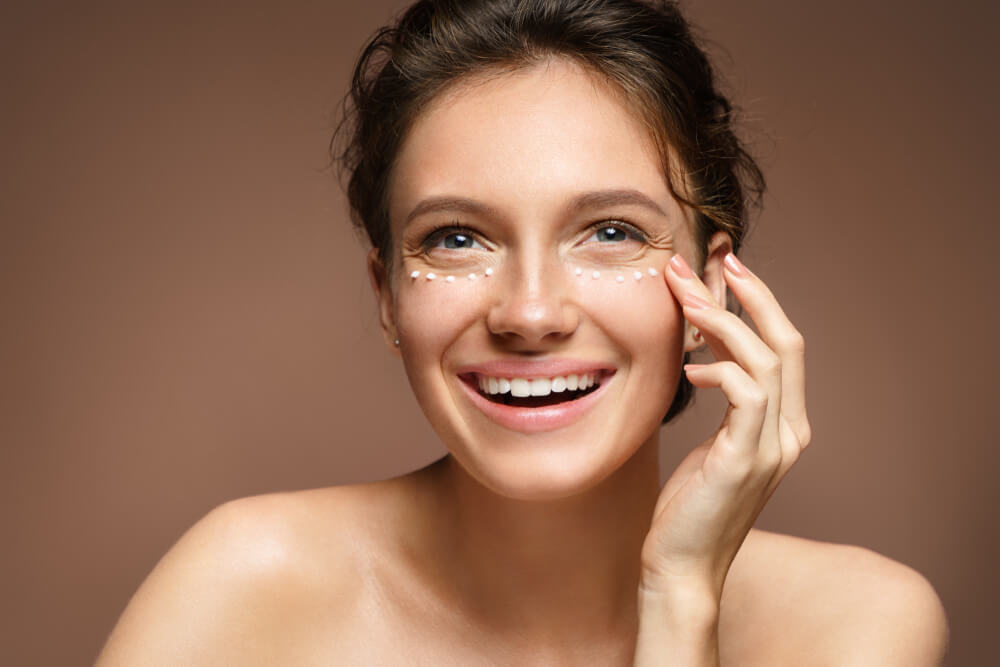 woman applying eye cream